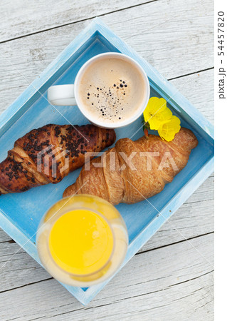 Coffee, orange juice and croissant 54457820