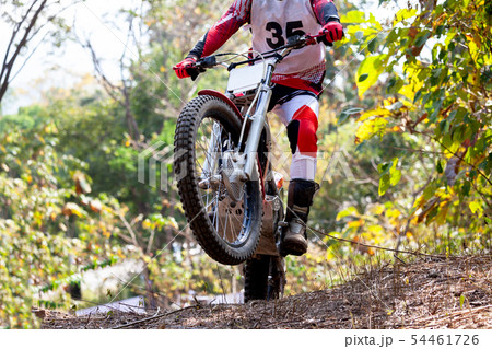 Trials motorcycle while competition in nature 54461726