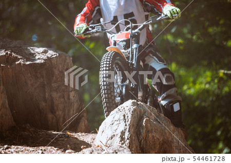 Trials motorcycle in competition 54461728