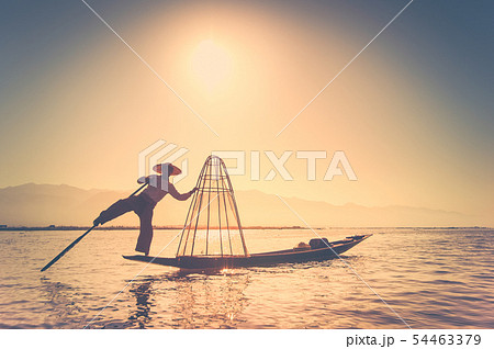 Burmese fisherman catching fish. Myanmar 54463379