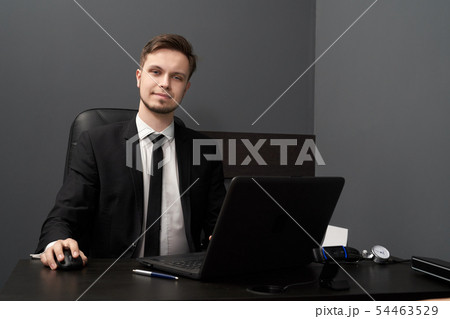 Man in smart suit posing while working with lie detector 54463529