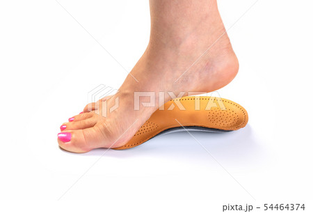 orthopedic insole and female leg 54464374