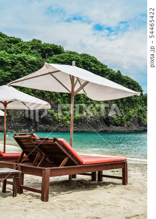 Beach lounge chairs with umbrella 54465422