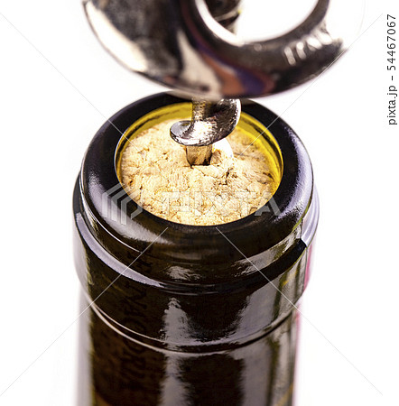 The opening a wine bottle with a cork screw The opening a wine bottle with a cork screw 54467067