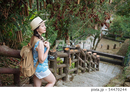 woman backpacker walk down stone slab stair woman backpacker walk down stone slab stair 54470244