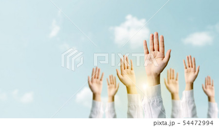 Group of hand businessmen raised the sky 54472994