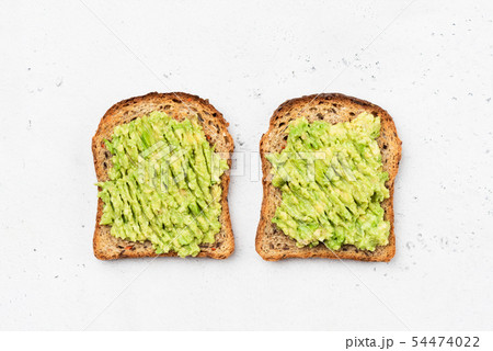 Avocado toast on whole grain sandwich bread Avocado toast on whole grain sandwich bread 54474022