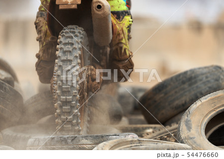 Action of enduro motorcycle, obstacle tires Action of enduro motorcycle, obstacle tires 54476660