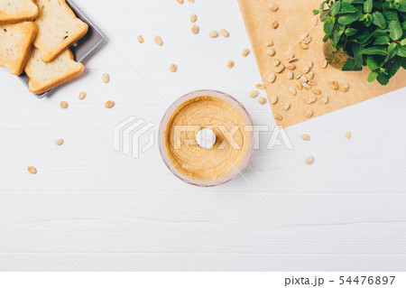 Cooking homemade peanut butter Cooking homemade peanut butter 54476897