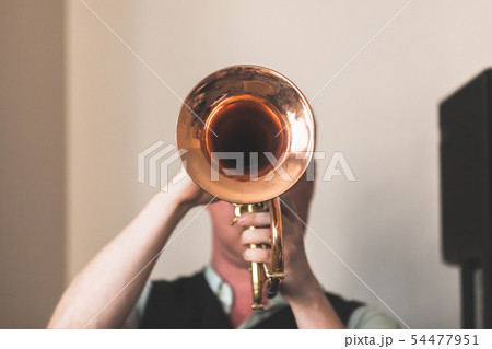 Trumpeter with a trumpet in hands Trumpeter with a trumpet in hands 54477951
