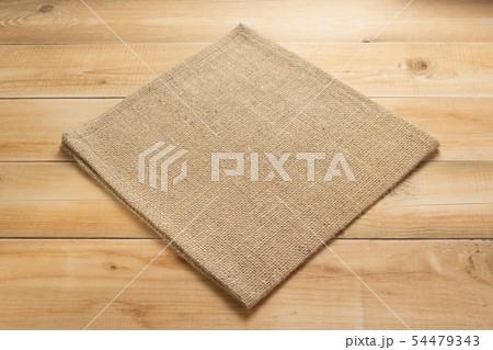 burlap hessian sacking cloth on wooden background burlap hessian sacking cloth on wooden background 54479343