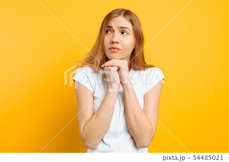 The excited girl is frightened by something, bites The excited girl is frightened by something, bites 54485021