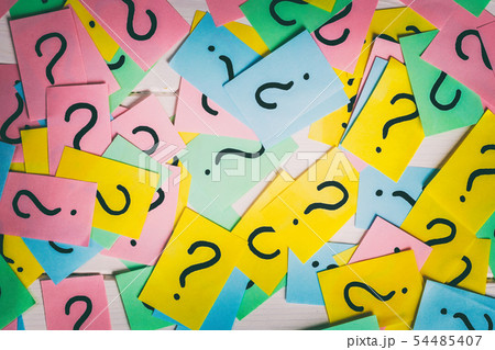 colorful paper notes with question marks. Closeup colorful paper notes with question marks. Closeup 54485407