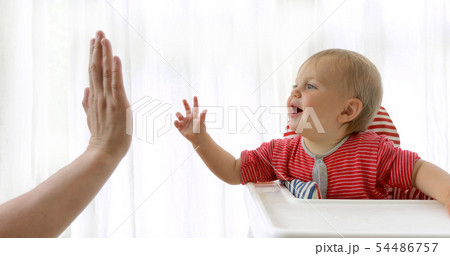 Adorable happy baby playing with parent indoors 54486757