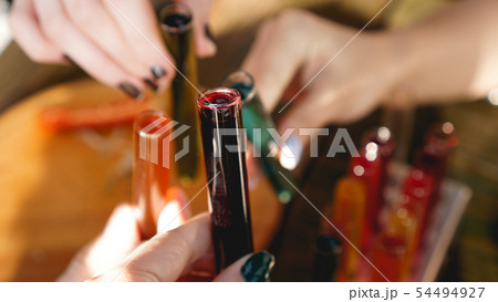 Test tubes with multi-colored liquid. Alcohol in test tubes dark bar Test tubes with multi-colored liquid. Alcohol in test tubes dark bar 54494927