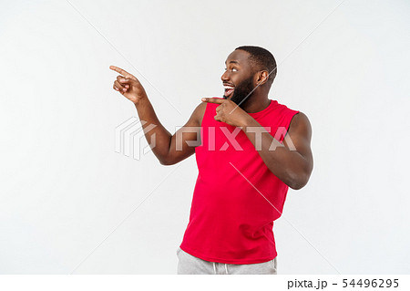 Young african american sport man pointing finger with surprised, feels successful and prosperous 54496295