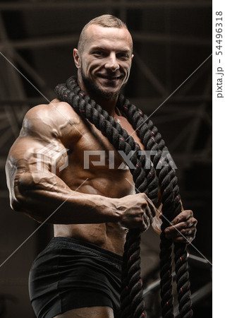 fitness athletes training using battle ropes fitness athletes training using battle ropes 54496318