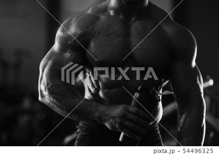 fitness man drinking water after workout fitness man drinking water after workout 54496325