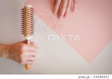 hair fall and lost alopecia woman problem on the 54496852