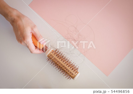 hair fall and lost alopecia woman problem on the 54496856
