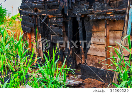 Old house made of wood half burnt Old house made of wood half burnt 54500529