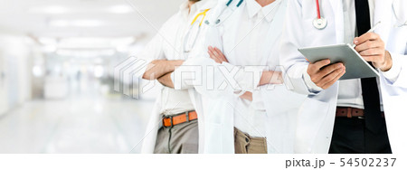 Doctor working in hospital with other doctors. Doctor working in hospital with other doctors. 54502237