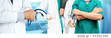 Doctor working in hospital with other doctors. 54502300
