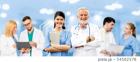 Doctor working in hospital with other doctors. 54502576