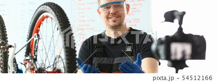 Joyful Engineer Taking Care of Mountain Bicycle 54512166