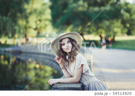young girl laughing in hat 54513920