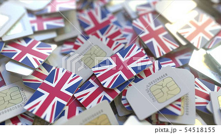 Pile of SIM cards with flag of the United Kingdom. British mobile telecommunications related Pile of SIM cards with flag of the United Kingdom. British mobile telecommunications related 54518155