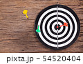 Darts Board with arrow on wood background 54520404