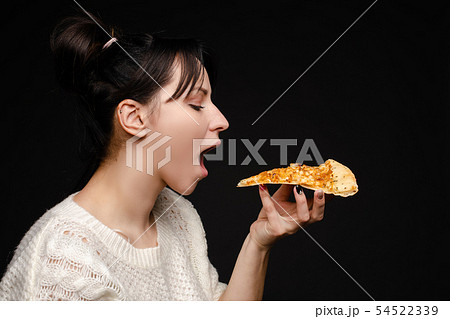 Close-up face of hungry young woman open mouth Close-up face of hungry young woman open mouth 54522339