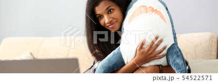 Smiling black woman hold in hands shark toy 54522571