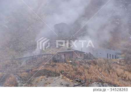 Steam is coming out from the hot spring of 54528263