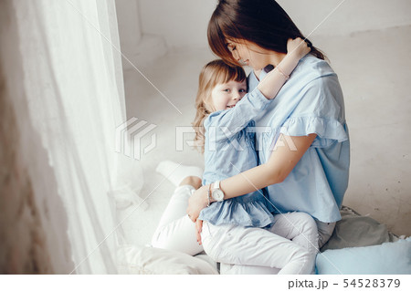 Mother with little daughter in a room Mother with little daughter in a room 54528379