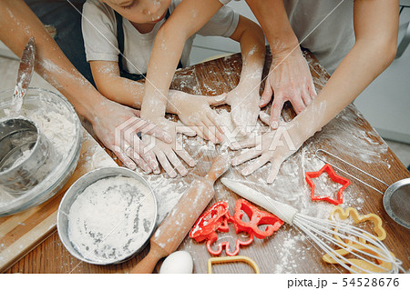 Family cook the dough for cookies 54528676