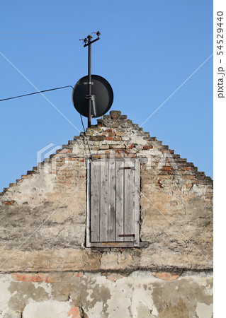 Old house and satelite antenna 54529440