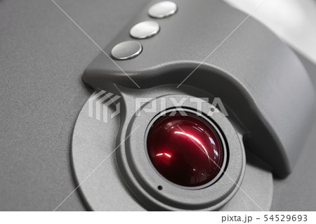 Red trackball, close up 54529693