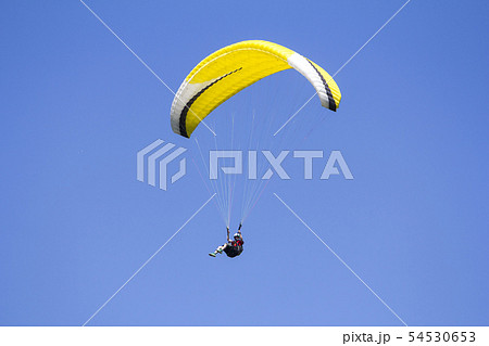 Paragliding in the blue sky as background extreme Paragliding in the blue sky as background extreme 54530653