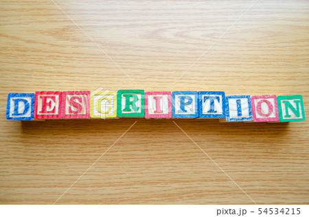 Educational toy cubes with letters organised to display word DESCRIPTION - editing metadata and 54534215