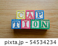 Educational toy cubes with letters organised to display word CAPTION - editing metadata and Search 54534234