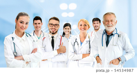 Doctor working in hospital with other doctors. 54534987
