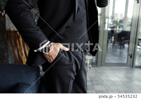 Close up of handsome businessman, working on laptop in restaurant 54535232