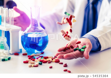 Medicine pills and tablets in research lab. 54535364