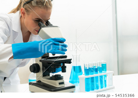 Woman scientist working in chemist laboratory. 54535366