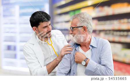 Doctor checking patient health in hospital office. Doctor checking patient health in hospital office. 54535665