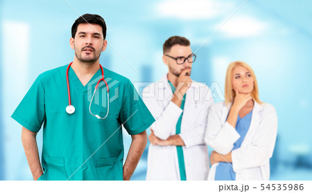 Doctor working in hospital with other doctors. Doctor working in hospital with other doctors. 54535986