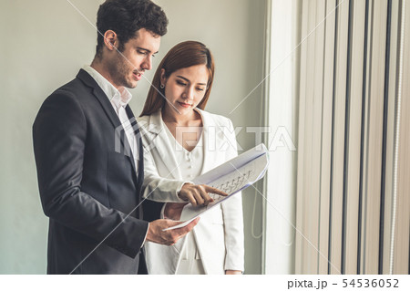 Businesswoman meeting with businessman in office. Businesswoman meeting with businessman in office. 54536052