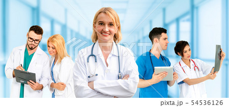 Doctor working in hospital with other doctors. 54536126